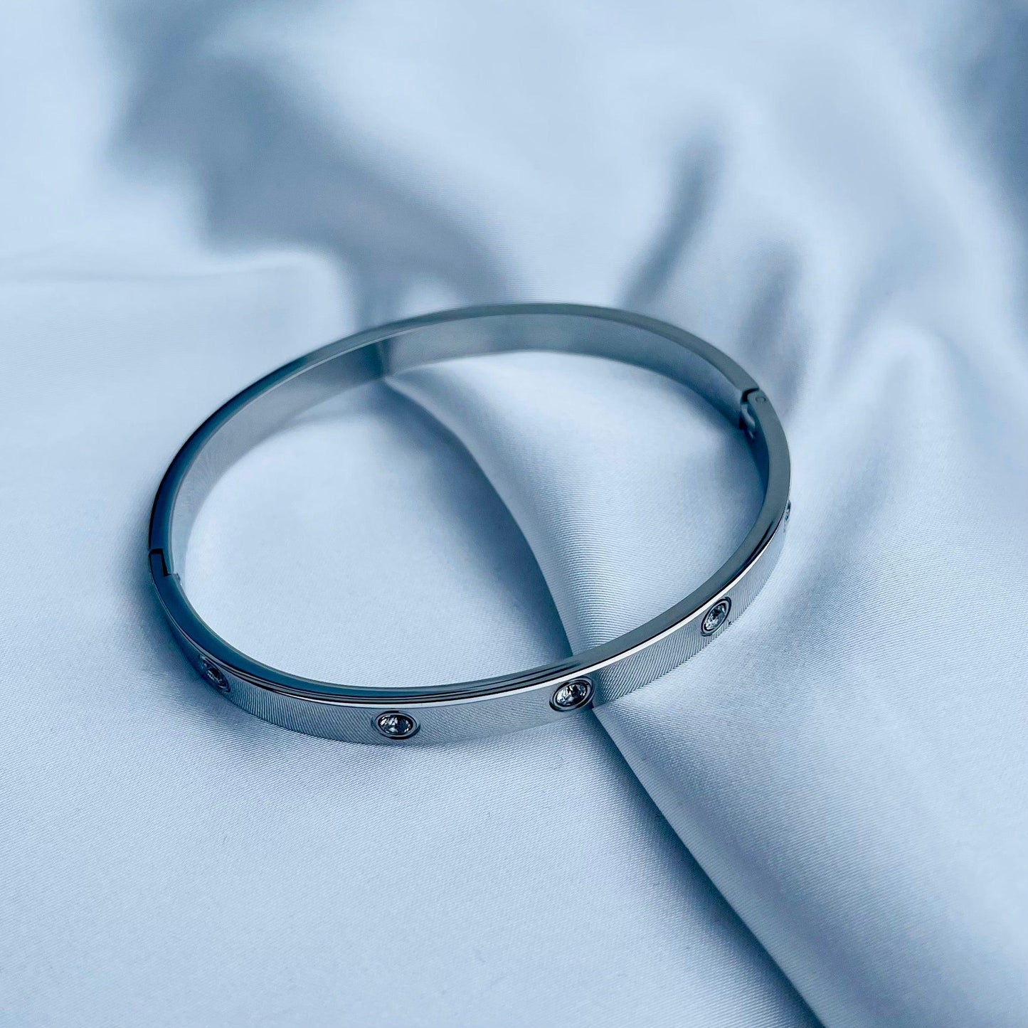 Radiant Elegance: Cubic Zirconia Stones Stainless Steel Bangle - Whisperz